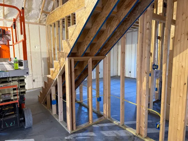 Insulated vaulted ceiling with open rafters