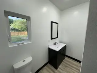 Long finished hallway with trim and flooring